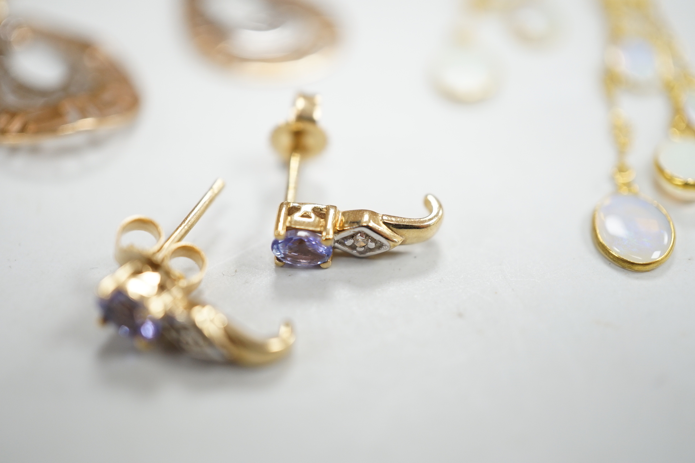 Two modern pairs of 14k drop earrings including pink cubic zirconia, 15mm, gross weight 10.1 grams, two similar pairs of 10k and gem set earrings, gross weight 2.7 grams and a modern pair of yellow metal and opal cluster